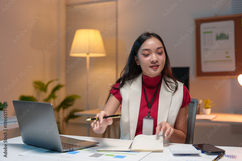 Asian businesswoman uses computer in office with documents Calculate work contacts Planning and analyzing financial reports business plan investment analytical concept business success. Asian businesswoman uses computer in office with documents Calculate work contacts Planning and analyzing financial reports business plan investment analytical concept business success.