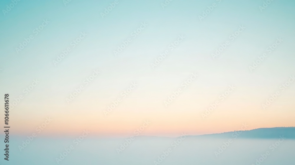 Fototapeta premium A stunning sunrise over the mountains, creating a soft and dreamy backdrop.