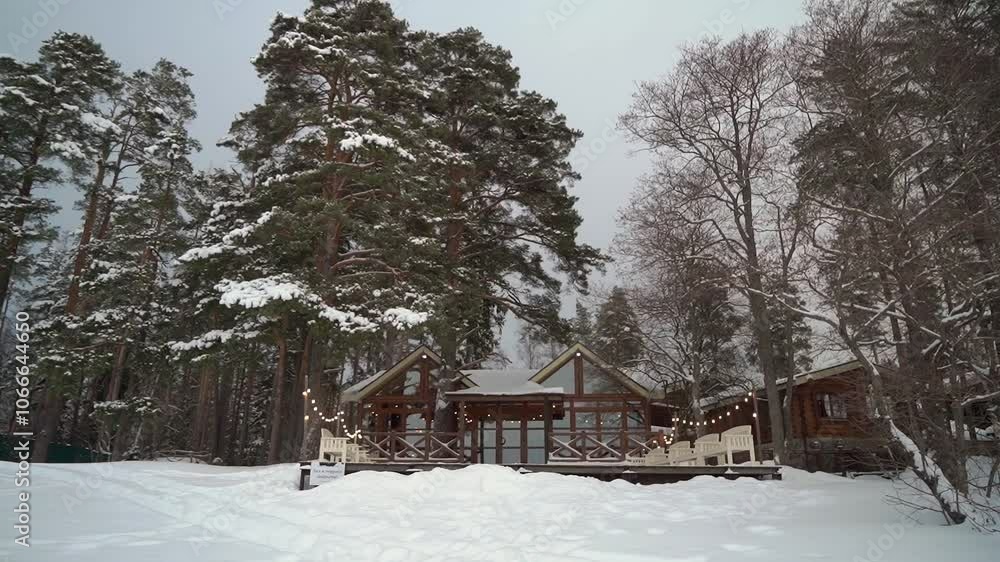 A beautiful winter setting with a cozy cabin in a snowcovered forest, ideal for holiday themes. Keywords snow, cabin, pine trees, tranquil, cozy. Perfect for a serene holiday getaway A beautiful winter setting with a cozy cabin in a snowcovered forest, ideal for holiday themes. Keywords snow, cabin, pine trees, tranquil, cozy. Perfect for a serene holiday getaway