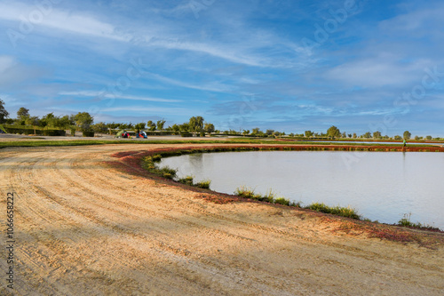 Al Qudra Lakes in Dubai’s Al Marmoom Desert Conservation Reserve, a serene man-made oasis home to black swans and flamingos, and a popular spot for recreation and picnics.