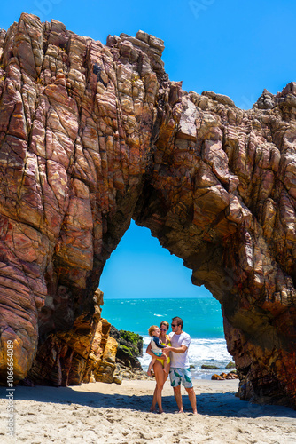 Young couple with son in Pedra Furada, Jericoacoara, Ceara photo