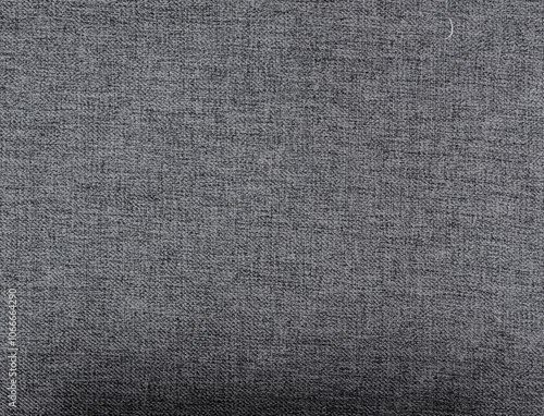 Close-up of gray denim fabric showcasing its detailed weave and rugged texture, Stone-washed gray denim texture — a classic textile background