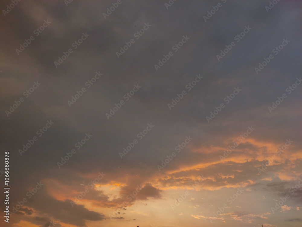 Dramatic sunset or sunrise sky on twilight with Blue, Purple, black, grey, Pink and Orange sunlight over city Dramatic sunset or sunrise sky on twilight with Blue, Purple, black, grey, Pink and Orange sunlight over city
