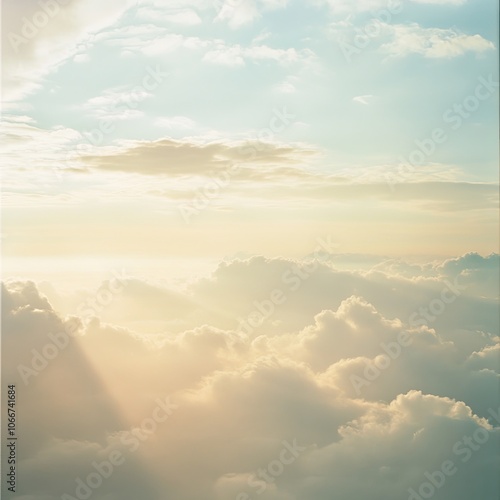 Explore the serene beauty of gentle clouds against a vibrant sky at sunrise