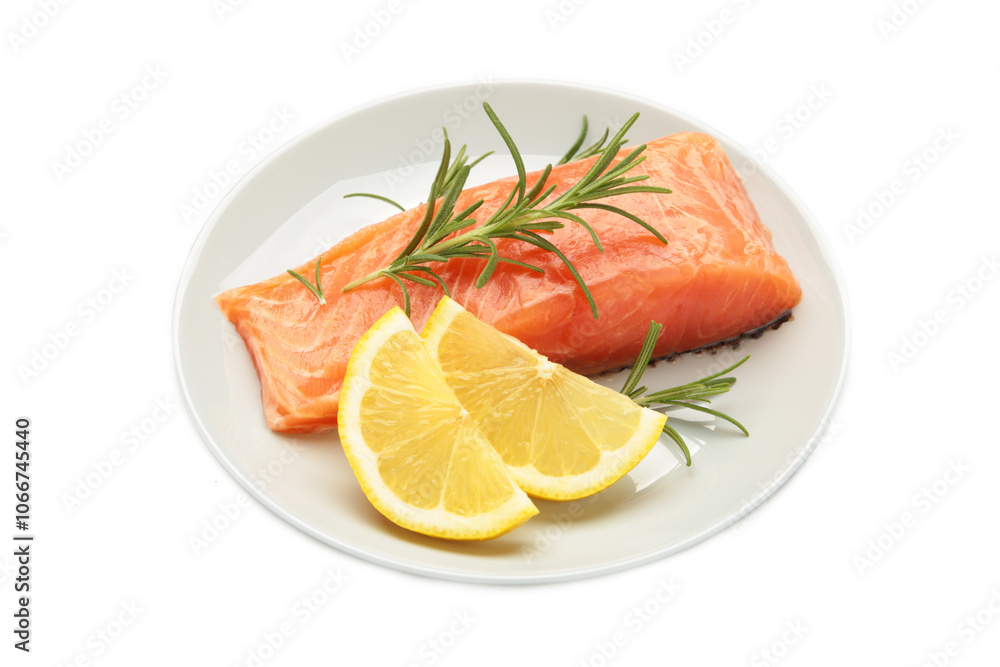 Red fish. Raw salmon fillet with rosemary and lemon on plate isolated on white background. Red fish. Raw salmon fillet with rosemary and lemon on plate isolated on white background.