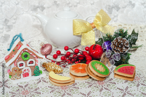 Preparing for the Christmas tea party. Beautiful cookies on a defocused festive background. Selective focus
