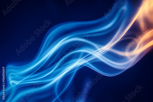 Smooth wisps of blue and orange smoke swirl gracefully across a dark background, creating a vibrant and ethereal visual effect with a sense of fluidity and motion