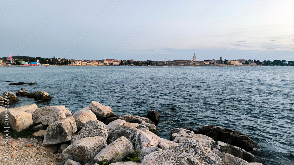 Poreč old town seen from the sea shore and it's narrow streets at dusk Poreč old town seen from the sea shore and it's narrow streets at dusk