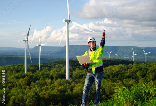 Male engineer working on wind turbines, wind farms or wind farms, clean energy sources, ecological technology for electricians, system alert