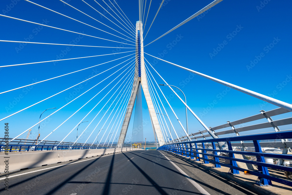 Naklejka premium View on cable-stayed bridge with high pylons&nbsp;across the&nbsp;Bay of Cadiz, linking&nbsp;Cadiz&nbsp;with&nbsp;Puerto Real&nbsp;in mainland Spain