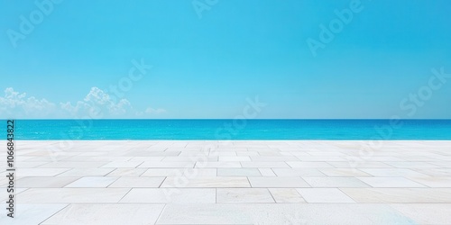 Serene ocean view with a clear blue sky and white stone patio.