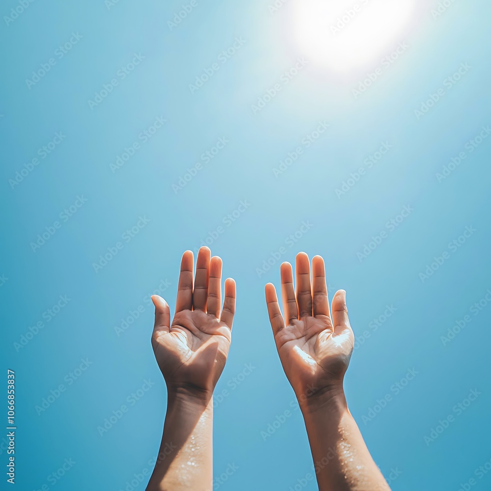 Two hands are raised in the air, reaching towards the sun Two hands are raised in the air, reaching towards the sun