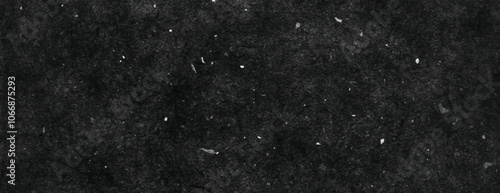 Dark black background, textured with speckles. The background is gritty and black, providing a rugged, black background effect. Minimal grunge speckled texture vector background