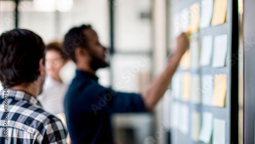 Team Strategy Session Blur - Blurred background of a brainstorming session among team members.
 photo