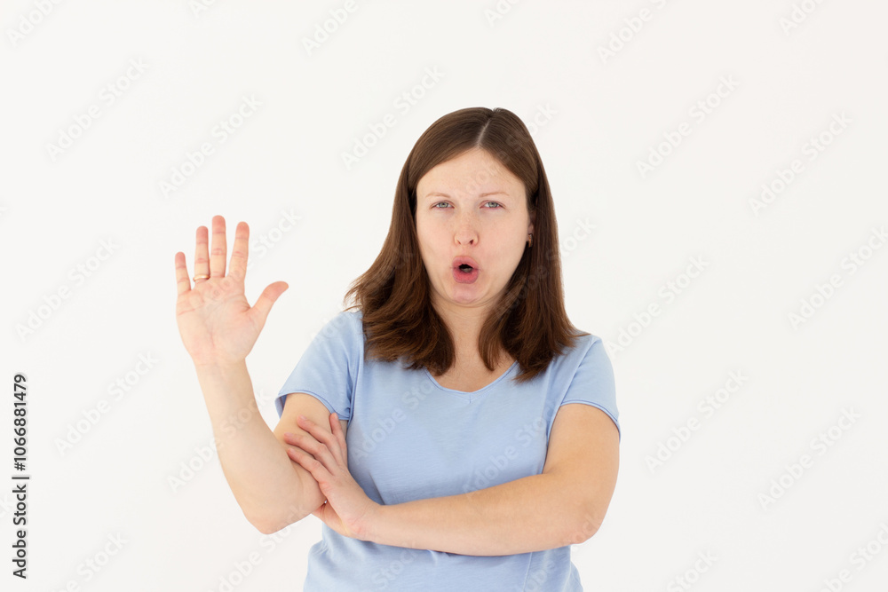 Portrait of young woman making stop sign in front of the camera. Portrait of young woman making stop sign in front of the camera.