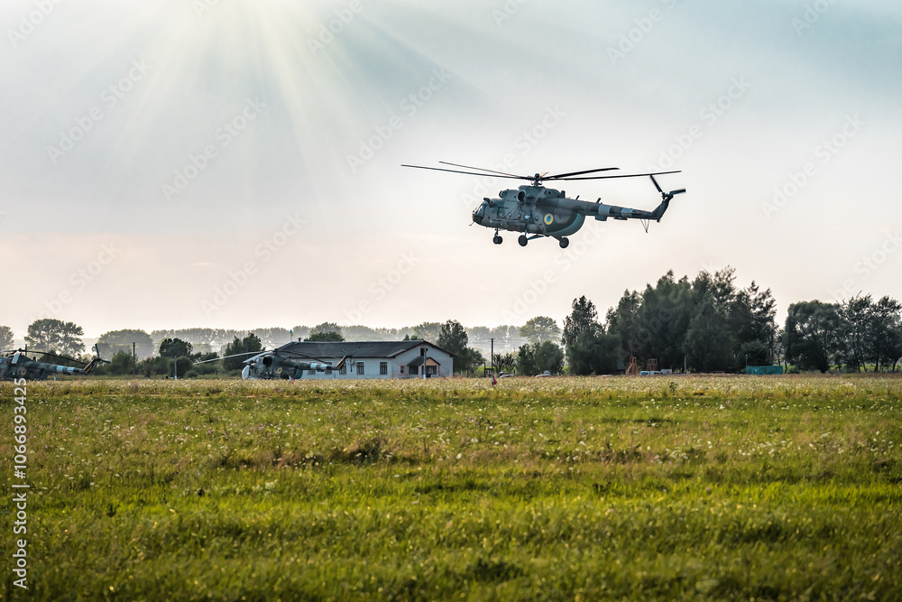 Military large aircraft helicopter flies over green field Military large aircraft helicopter flies over green field