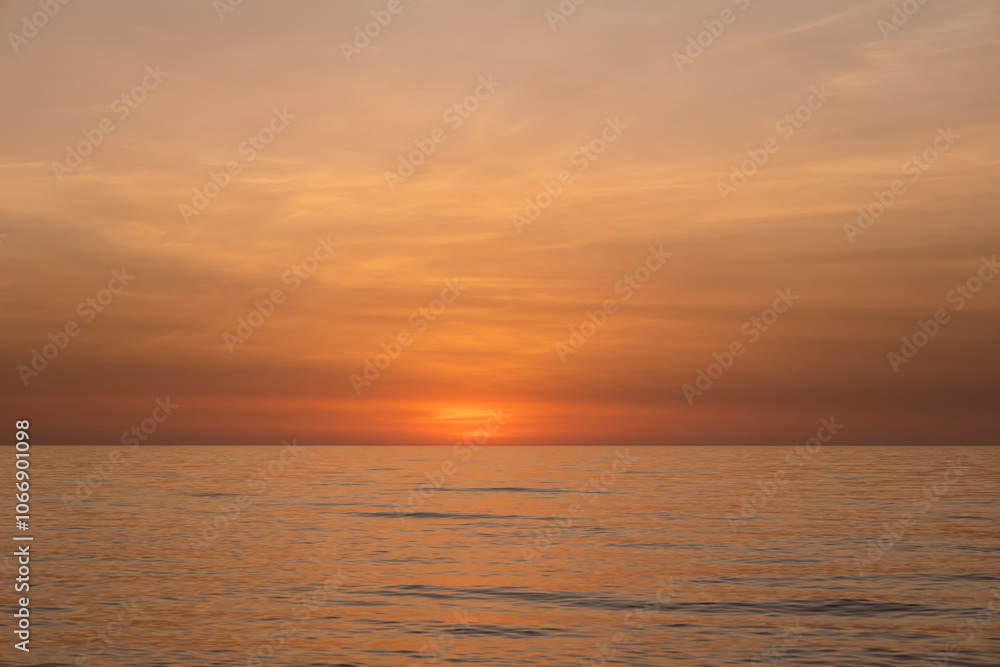 Calm sea in the evening silence in orange tones, relax Calm sea in the evening silence in orange tones, relax