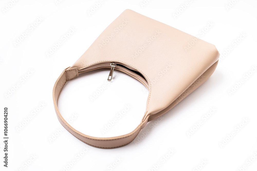 Women's leather beige bag isolated on white background. Fashionable stylish minimalist baguette bag, wine color. Female accessory, object for cutting and design Women's leather beige bag isolated on white background. Fashionable stylish minimalist baguette bag, wine color. Female accessory, object for cutting and design