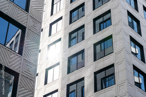 Modern Urban Architecture Showcased Among Tall Buildings Beneath a Blue Sky