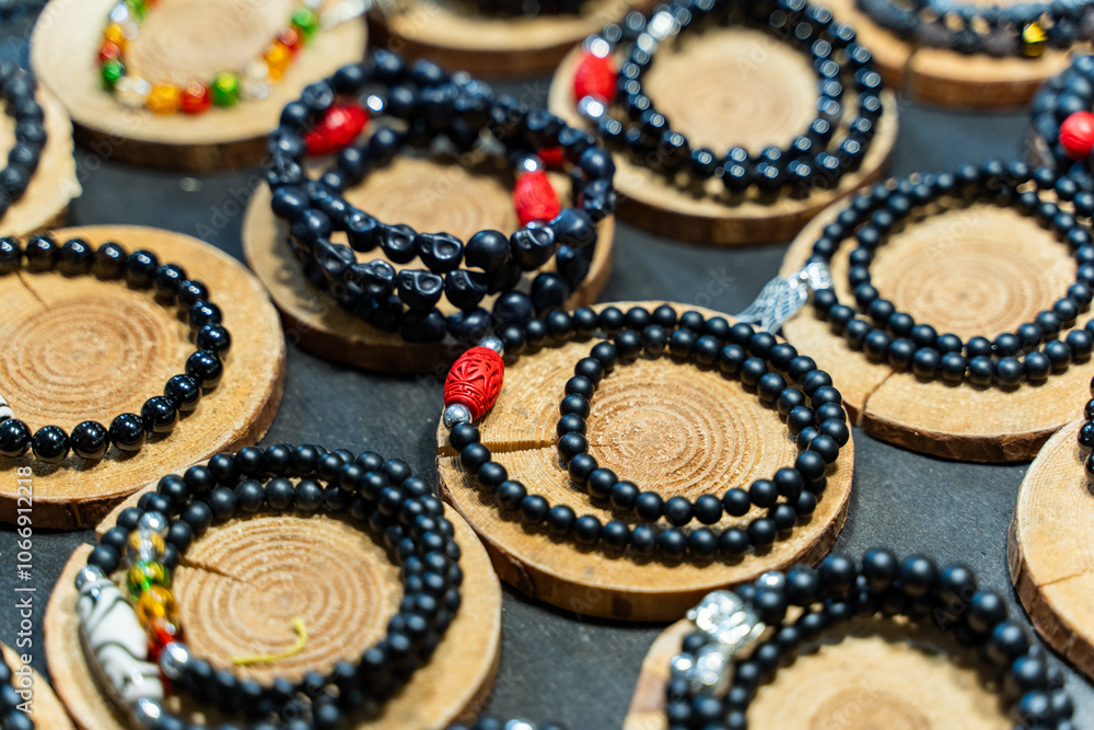 A beautiful array of elegant beaded bracelets is artfully displayed on wooden circles