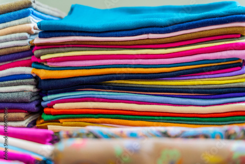 Obraz na płótnie A Colorful Collection of Beautifully Rolled Textiles Arranged in a Vibrant Market Display w salonie
