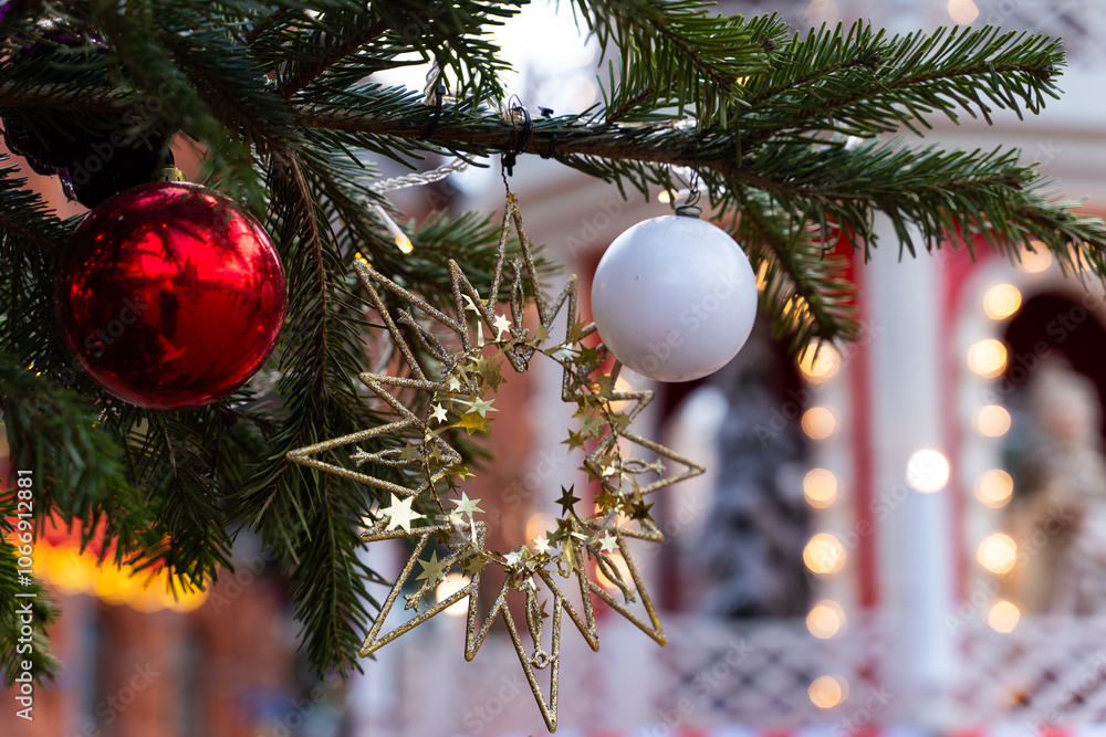 Festively decorated Christmas setting featuring bright red ornaments and a snowy background