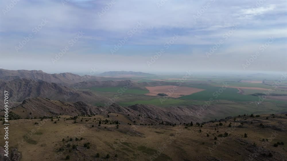 Drone captures Sierra de la Ventana peaks, valleys, and green fields to the horizon in Buenos Aires Drone captures Sierra de la Ventana peaks, valleys, and green fields to the horizon in Buenos Aires
