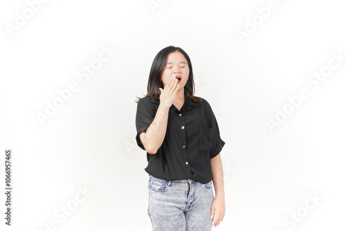 beautiful Asian woman strikes a sleepy pose, yawning with a tired expression against a white background