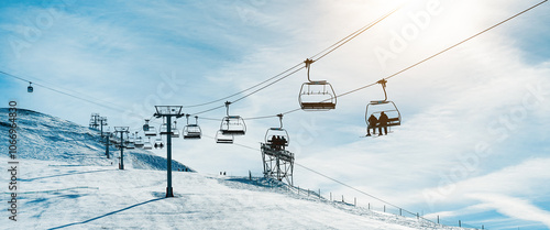 People on ski lift in winter sport resort - Travel and vacation concept - Focus on center cable car cabins