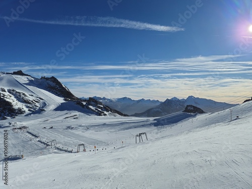 Ski resort in the mountains. Sunny day on Hintertuxer Glacier in Austrian Alps.