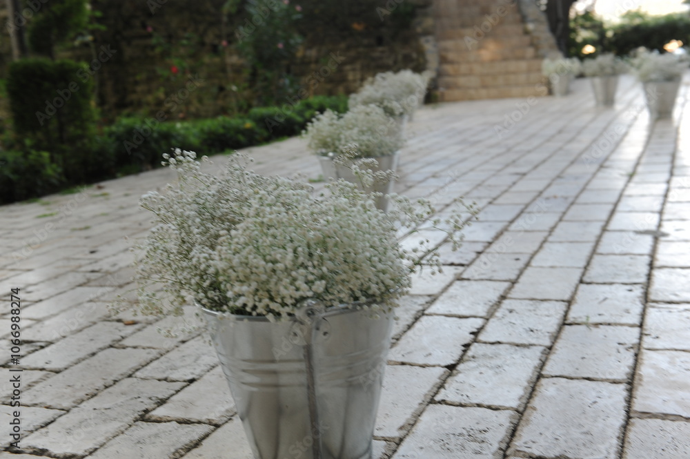 Romantic Outdoor Wedding Aisle Decorated with White Flowers