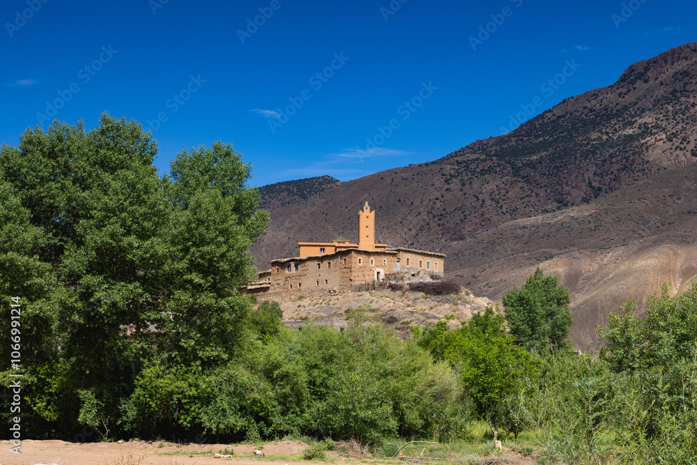 A Mosque on a hill above an apple orchard in Happy Valley. Aït Bouguemez Valley. A Mosque on a hill above an apple orchard in Happy Valley. Aït Bouguemez Valley.