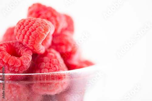 Close-up of raspberry fruit, one and several.