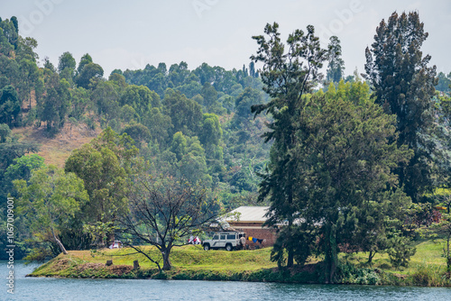 A sunset creates stunning colors over Lake Kivu with buildings nearby, Rwanda photo