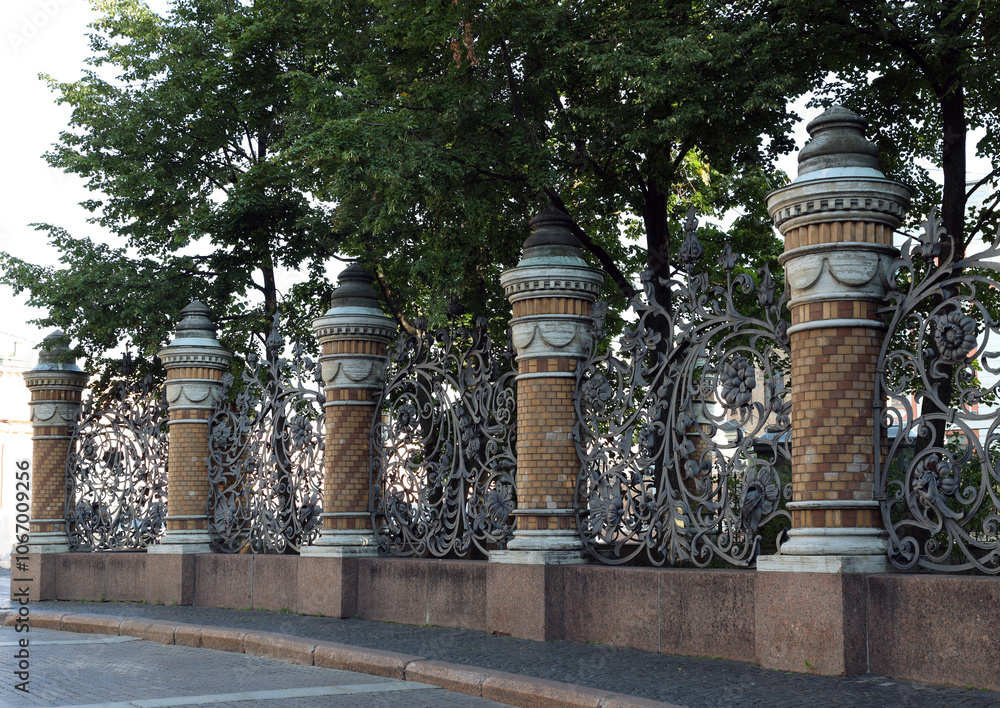 openwork metal fence of Mikhailovsky Park in Saint Petersburg. Russia openwork metal fence of Mikhailovsky Park in Saint Petersburg. Russia