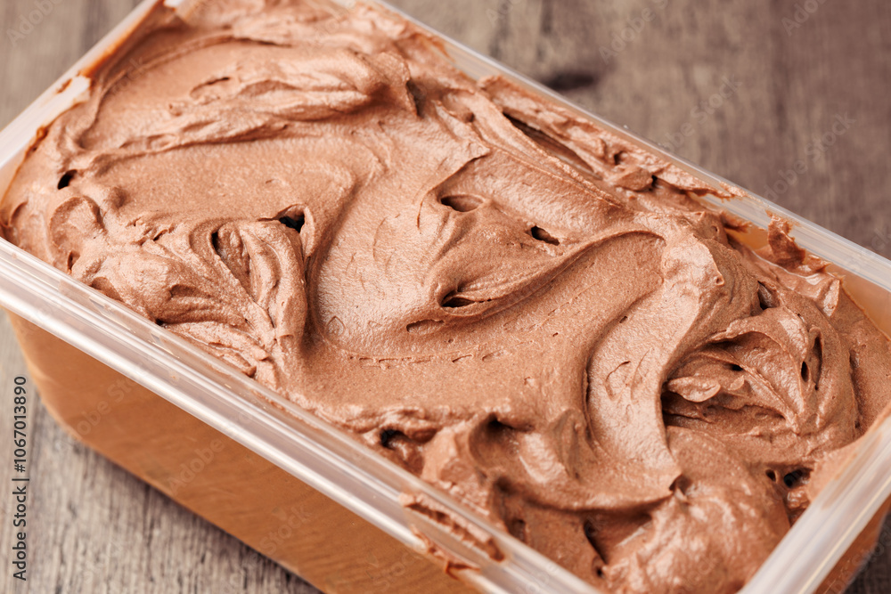 Homemade Organic chocolate Ice Cream in plastic container