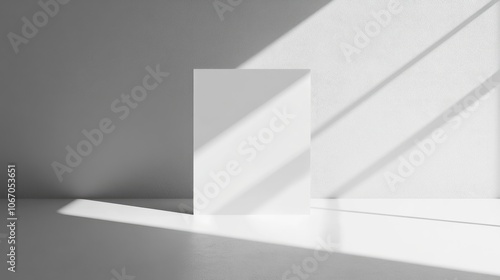 White square reflecting light with sharp geometric shadows, creating a minimalist, high-contrast visual on a clean background.