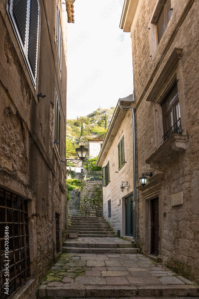 Fototapeta premium Picturesque medieval street in the old town district of the coastal city of Kotor