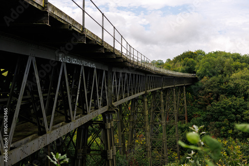 Looking across the top of the Victorian wrought iron Meldon Viaduct, disused railway line and part of the Granite Way, Dartmoor National Park, Devon, UK photo