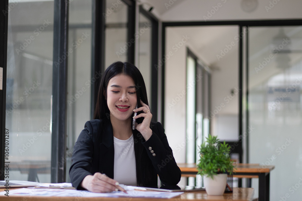 businesswoman talking on the phone in the office