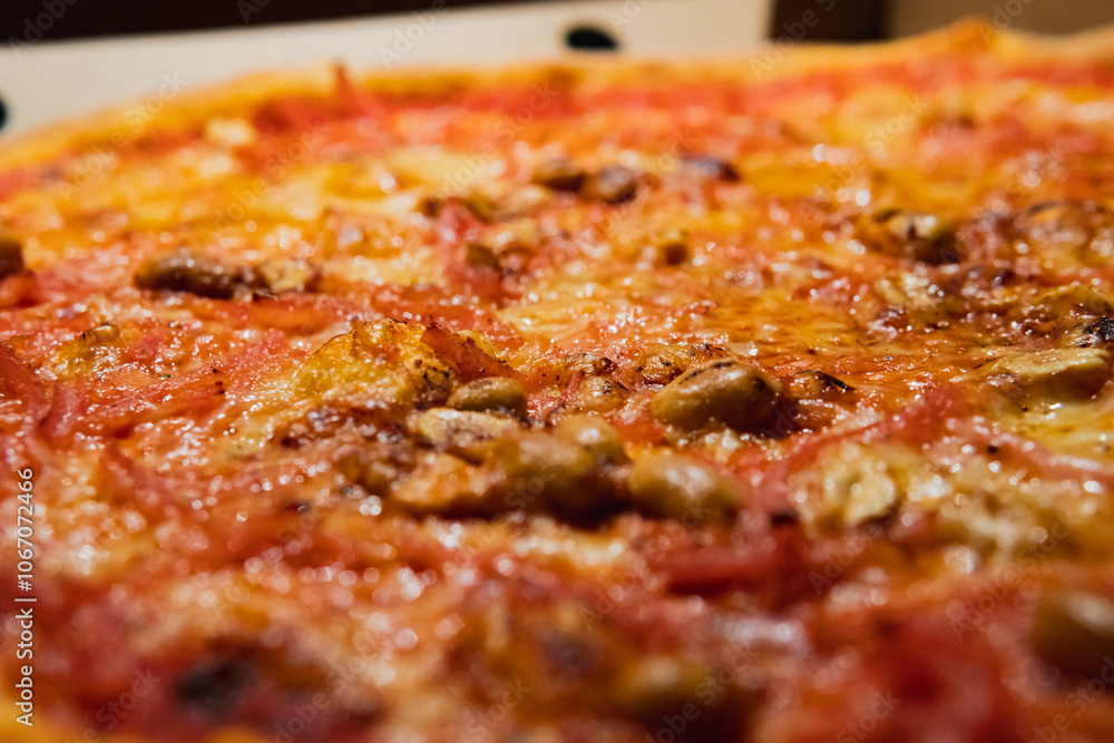 Close up photo of a delicious Swedish pizza. Topped with ham, cheese and peanuts. Close up photo of a delicious Swedish pizza. Topped with ham, cheese and peanuts.