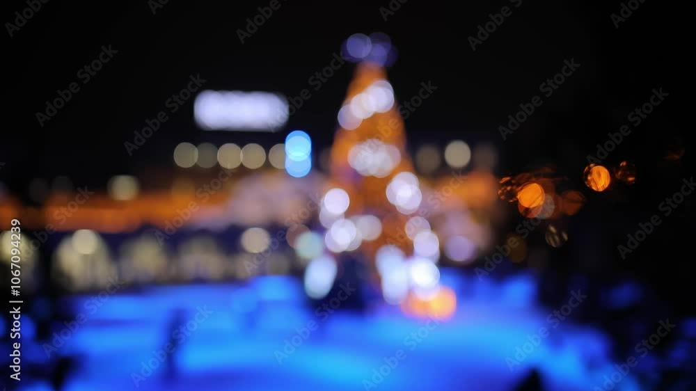 Blurred Ice Rink with Christmas Tree and Skaters Blurred Ice Rink with Christmas Tree and Skaters