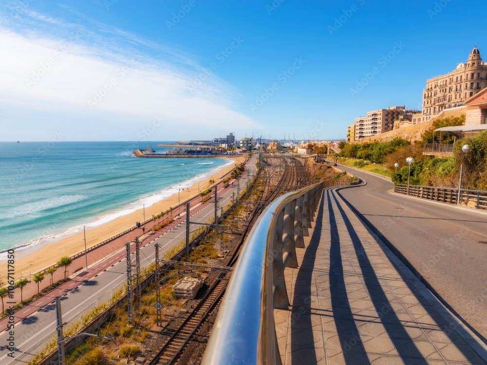 Obraz premium city life in Tarragona Spain. Structure of the industrial part of the city - Railways, highway, Mediterranean Sea, port, residential buildings, coastline. City problems