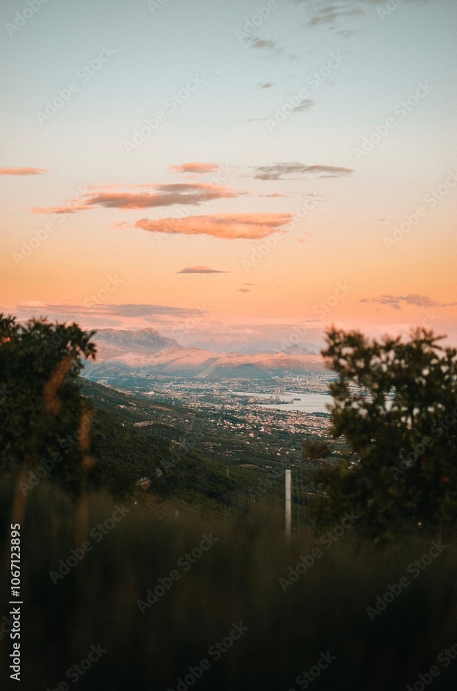 Obraz premium View from the top of the mountain with trees on the Adriatic sea at a beautiful bright sunset 