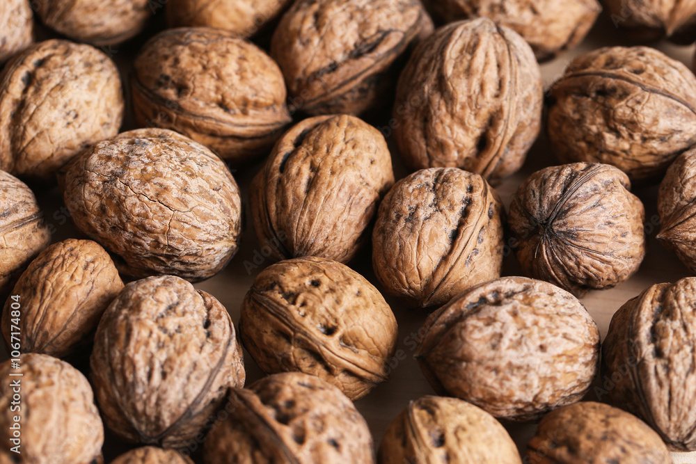 Walnuts texture. Shelled nuts background. Healthy organic snack. Rustic shells. Brown earthy tones. Closeup food pattern. Nutty details. Natural look wholesome food. Pile of walnuts. Raw texture... Walnuts texture. Shelled nuts background. Healthy organic snack. Rustic shells. Brown earthy tones. Closeup food pattern. Nutty details. Natural look wholesome food. Pile of walnuts. Raw texture...