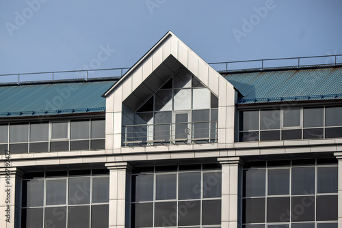 A building with a blue roof and a white triangle on the roof