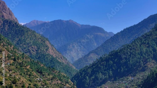 beatiful landscape of jibhi himchal mountains with pretty sky photo