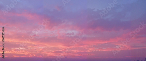 Vibrant purple and pink sunset sky with clouds