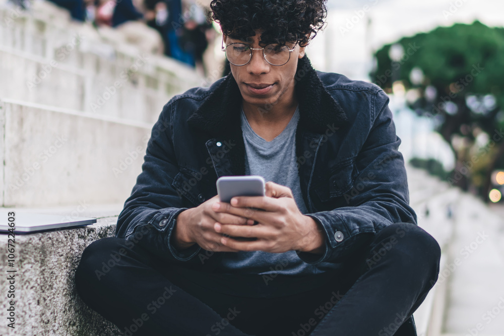 African American man using smartphone outdoors African American man using smartphone outdoors