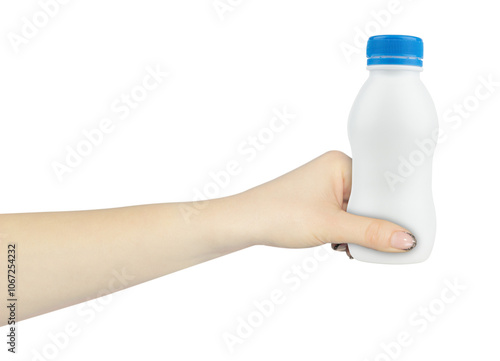 plastic white bottle, milk bottle in hand, outstretched hand with bottleisolated from background photo